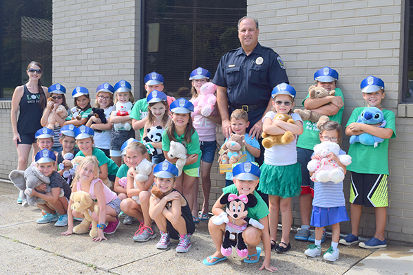 Cheerleaders donate teddy bears